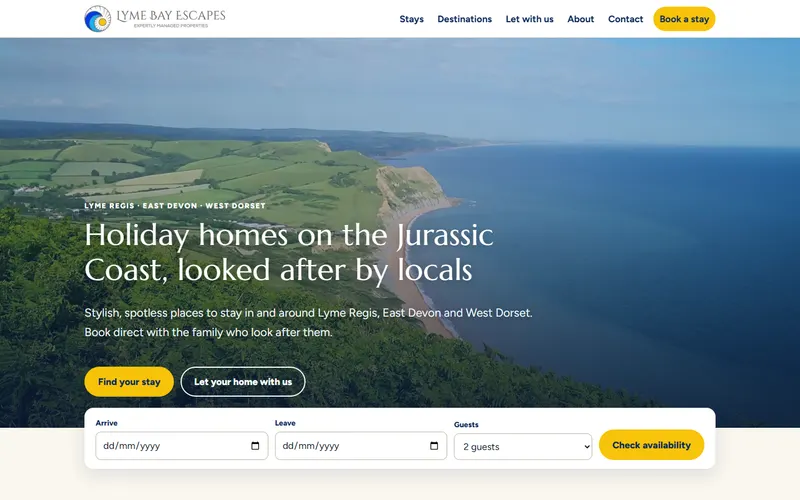 The Lyme Bay Escapes home page: a clifftop photo of the Jurassic Coast with a booking search